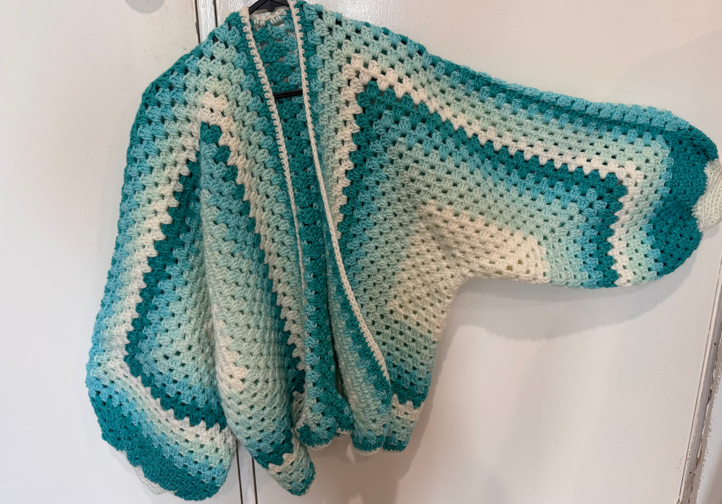 Homemade blue and white crochet cardigan