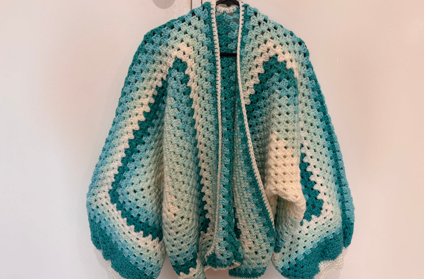 Homemade blue and white crochet cardigan